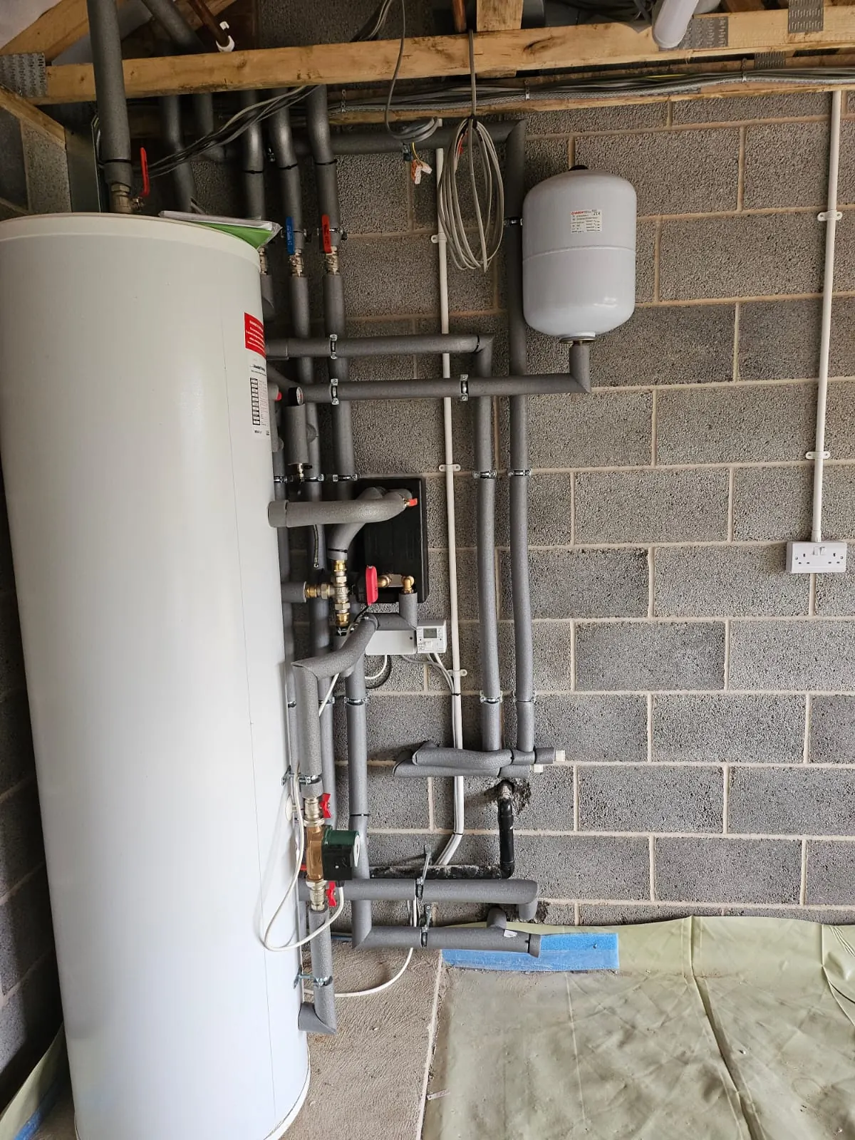 Plant room pipework for renewable heating installation.