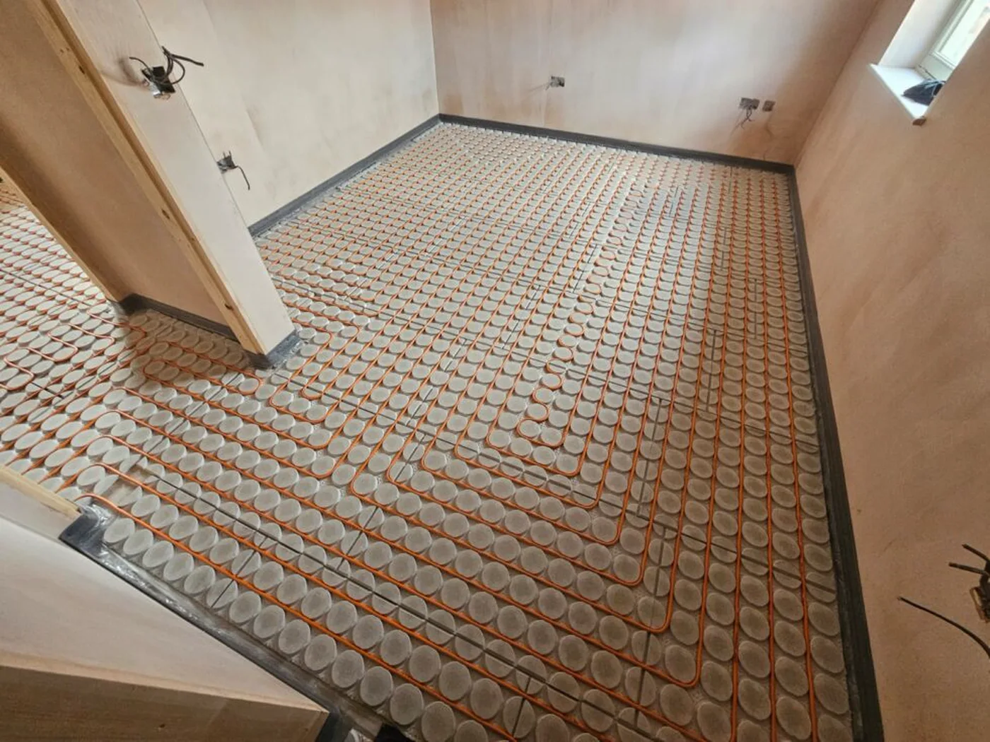 Variotherm overlay underfloor heating installed across a renovation room.